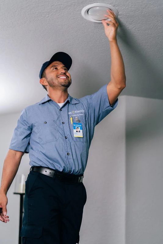 Mr. Electric of Wichita electrician installing retrofit recessed lighting.