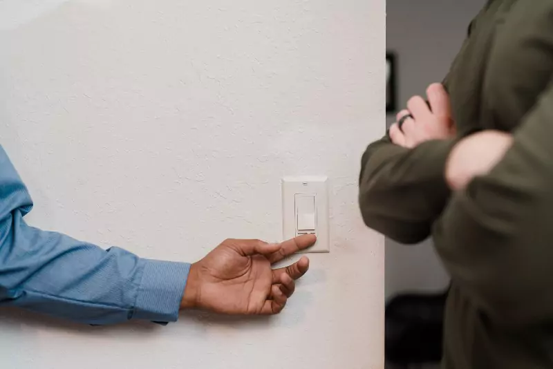 A Mr. Electric of Gastonia electrician testing out a light dimmer.