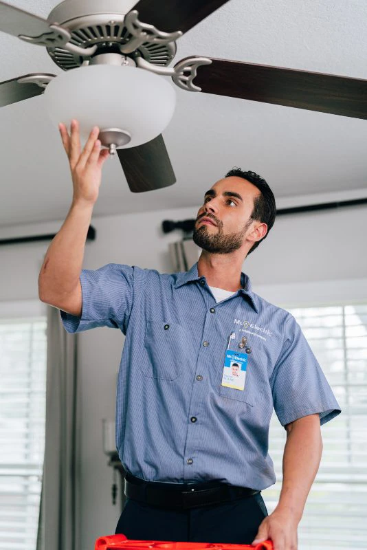 MRE Electrician installing a ceiling fan.