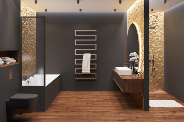 Black and gold bathroom interior demonstrating the effect of layered light sources.