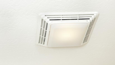 White exhaust fan in a bathroom.